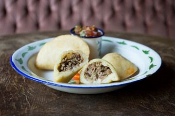 Venezuelan empanadas are made from precooked white or yellow cornmeal.