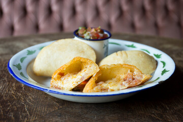 Venezuelan empanadas are made from precooked white or yellow cornmeal.