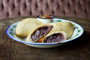 Venezuelan empanadas are made from precooked white or yellow cornmeal.