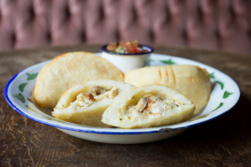 Venezuelan empanadas are made from precooked white or yellow cornmeal.
