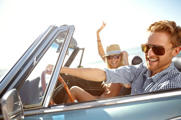 Car road trip, happy travel and couple on bonding holiday adventure, transportation journey or fun summer vacation. Love flare, convertible automobile and driver driving on Canada countryside tour