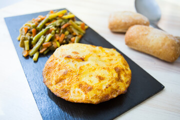 Tortilla Española. Traditional Spanish omelette made with fried potato, onion and egg.