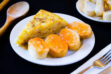 Tortilla Española. Traditional Spanish omelette made with fried potato, onion and egg.