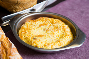 Tortilla Española. Traditional Spanish omelette made with fried potato, onion and egg.