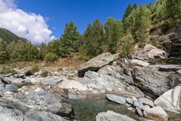 Lillaz waterfall (Cascate di Lillaz) in forest feeds into the Torrente Grand Eyvia in the Parco Nazionale del Gran Paradiso (Gran Paradiso National Park) Aosta valley, Italy