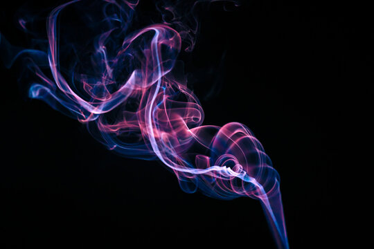 Colored smoke on a black background.