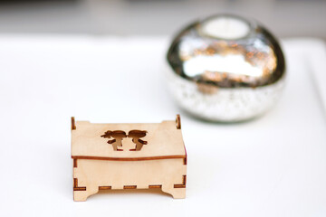 Wedding decor. Ring wooden  box with inscription on white table.Green background