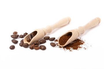 Ground coffee and beans in wooden spoons isolated on white background.