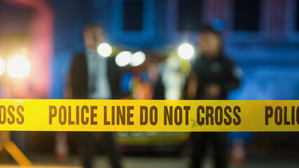 "Do-not-Cross" Tapes Restricting Access to Crime Scene in a Back Alley. Detectives Inspecting the Body and Thinking About the Murderer's Motive. CSI Team On Duty During the Night