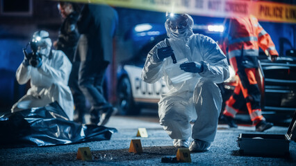 Police Department Team Working on a Crime Scene, Collecting Evidence and Packing Murder Weapon....