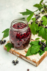 black currant jam curd, custard or jam in jar. place for text, top view