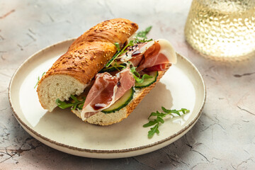 Delicious appetiser Italian prosciutto and Spanish Iberian ham snack. Delicious breakfast or snack, top view