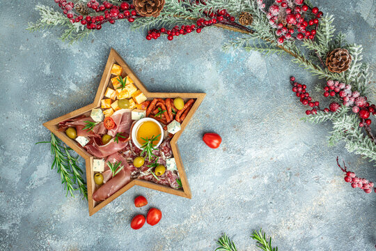 Assorted cheeses and deli meat appetizers. Festive Appetizer for christmas table. place for text, top view