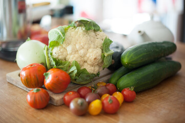 Fresh from the garden - colorful tomatoes, cucumbers and cauliflower