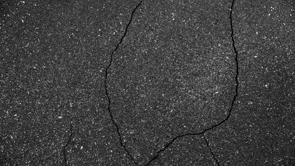 Obraz premium Textura de carretera agrietada y antigua de color negro