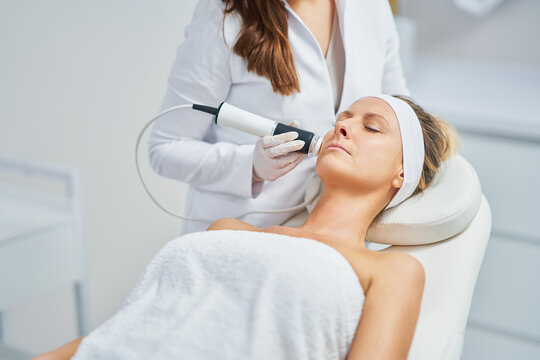 Woman in a beauty salon having face and body treatment