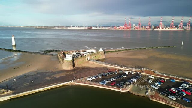 Fort Perch Rock, New Brighton, River Mersey, Wirral -  aerial drone clockwise pan, Liverpool waterfront reveal on a sunny winter afternoon 08.01.23