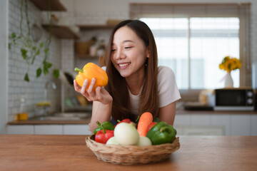 Portrait of beautiful young asian woman making salad at home. cooking food and Lifestyle moment