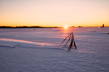 dawn on frozen lake in Sweden