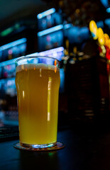 glass of light beer in a bar or pub