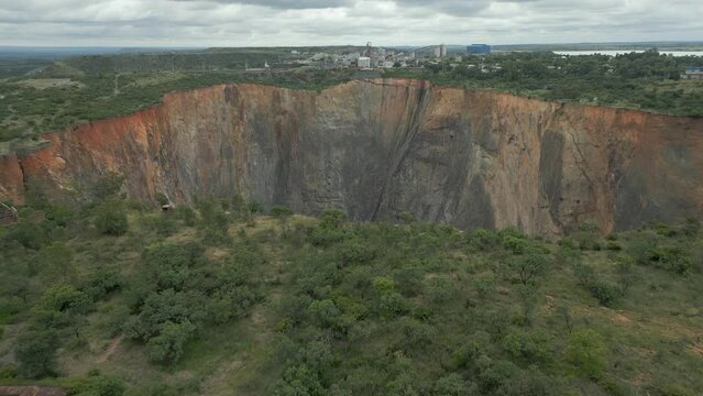 Aerial retreat from rim of Cullinan Diamond Mine big hole in S Africa