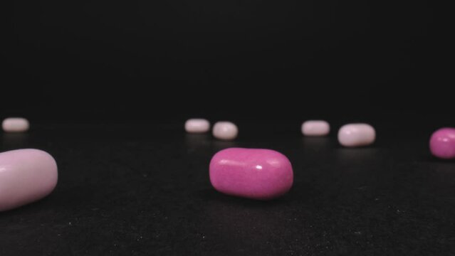 Tic Tac fresh breath mints. The camera passes in between. Dolly shot with macro probe lens. Slider movement.