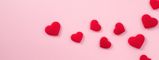 Valentine's Day design concept of red heart on pink background.