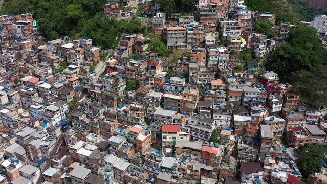 Cantagalo and Pavao-Pavaozinho Favelas. Rio de Janeiro, Brazil. Aerial View. Drone Flies Backwards and Upwards