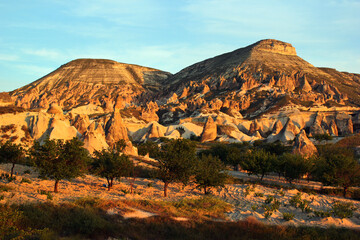Landscape with unusual rocks and karst formations near Goreme town in Cappadocia, central Turkey