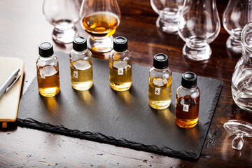 tasting bottles and glasses of whisky spirit brandy cognac. tasting at home