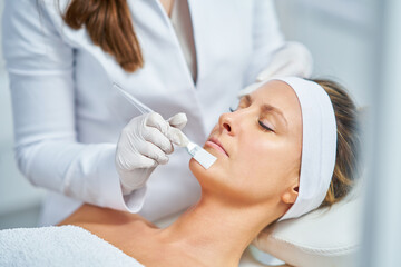 Woman in a beauty salon having face and body treatment