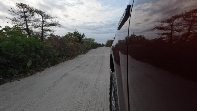 Driving on the beach in a pickup