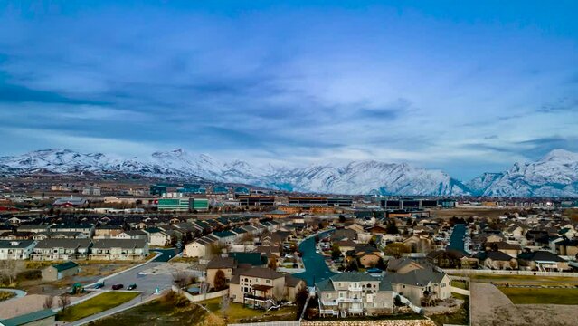 Lehi, Utah and Silicon Slopes in Winter with snow in the mountains - aerial hyper lapse at twilight