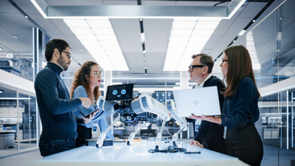 Professional Multicultural Team of Female and Male Engineers Use Industrial Programmable Robot Animal in a Factory Development Workshop. Tech Facility with Machines, Computers and Research Equipment.