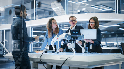Robotics Engineer, Project Manager and Machinery Operators Collaborate on a Robot Canine Project,...