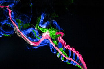 Colored smoke on a black background.