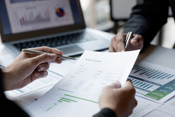 The sales department is having a monthly summary meeting to bring it to the department manager, they are verifying the correctness of the documents that are prepared before bringing in to the manager