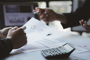 The sales department is having a monthly summary meeting to bring it to the department manager, they are verifying the correctness of the documents that are prepared before bringing in to the manager