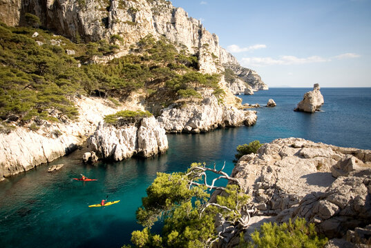 Two kayakers in Les Calanques near Cassis, France.