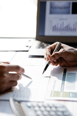 The sales department is having a monthly summary meeting to bring it to the department manager, they are verifying the correctness of the documents that are prepared before bringing in to the manager