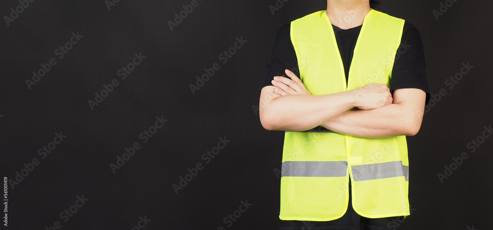 Wall mural Man wear Safety Vest on black background.