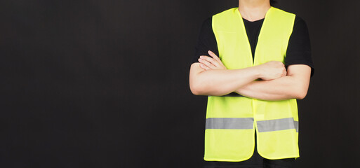 Man wear Safety Vest on black background.