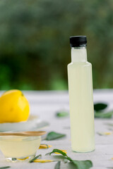 various salad vinegars in glass bottles. Front and top view. apple, lemon, strawberry, quince, grape, melon, apricot, tangerine, orange, grapefruit,