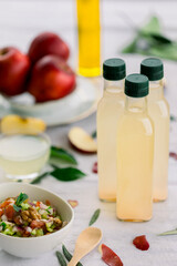 various salad vinegars in glass bottles. Front and top view. apple, lemon, strawberry, quince, grape, melon, apricot, tangerine, orange, grapefruit,