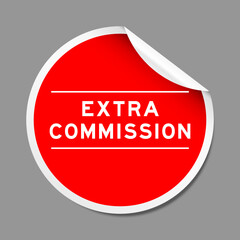Red color peel sticker label with word extra commission on gray background