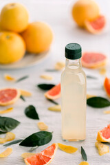 various salad vinegars in glass bottles. Front and top view. apple, lemon, strawberry, quince, grape, melon, apricot, tangerine, orange, grapefruit,