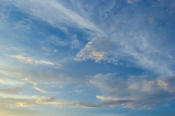 clouds in the sky illuminated by the sun summer evening. background