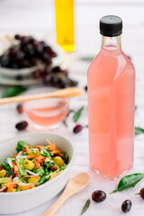 various salad vinegars in glass bottles. Front and top view. apple, lemon, strawberry, quince, grape, melon, apricot, tangerine, orange, grapefruit,