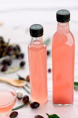various salad vinegars in glass bottles. Front and top view. apple, lemon, strawberry, quince, grape, melon, apricot, tangerine, orange, grapefruit,