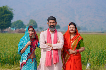 Fototapeta na wymiar Indian rural people standing at agriculture field.
